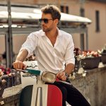 Stylish italian man wearing white shirt and sitting on classic s